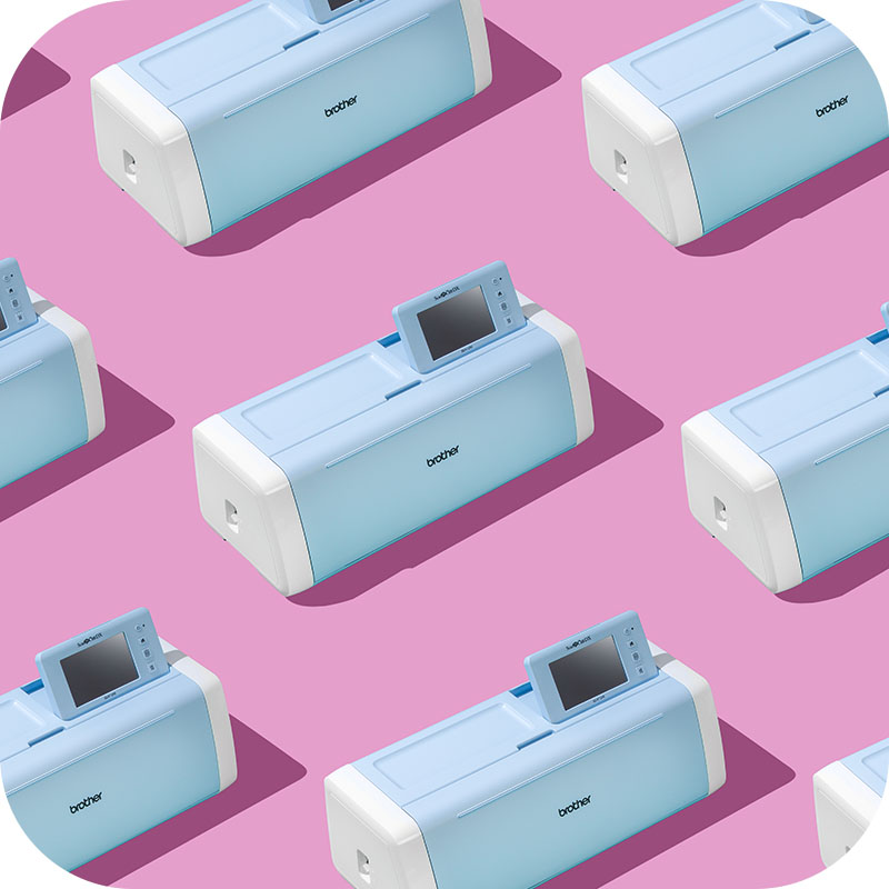 Hobby Maker machine laid out pn pink background