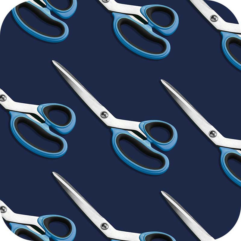 Sewing Street blue scissors laid out on dark blue background